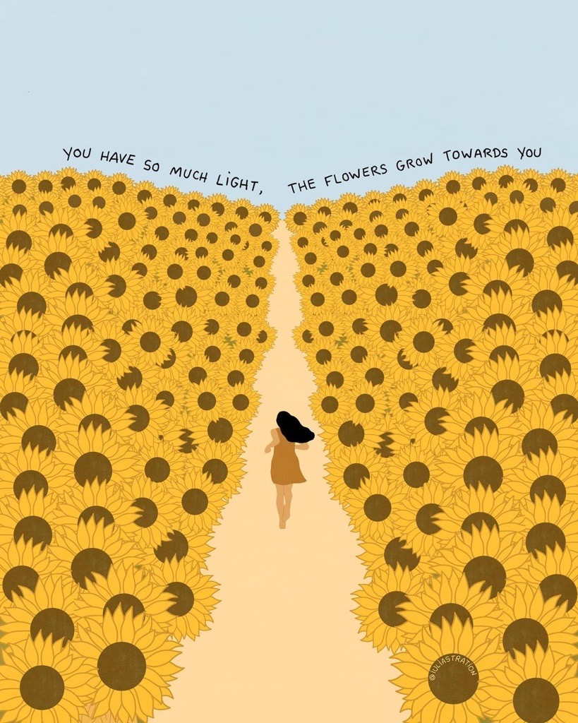 A person running through a field of sunflowers